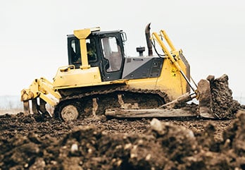 Dozer moving dirt on construction site